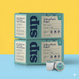 Two boxes of Signature Roast Superfood Herbal Coffee  BPA Free Pods with individual coffee pods displayed in front.